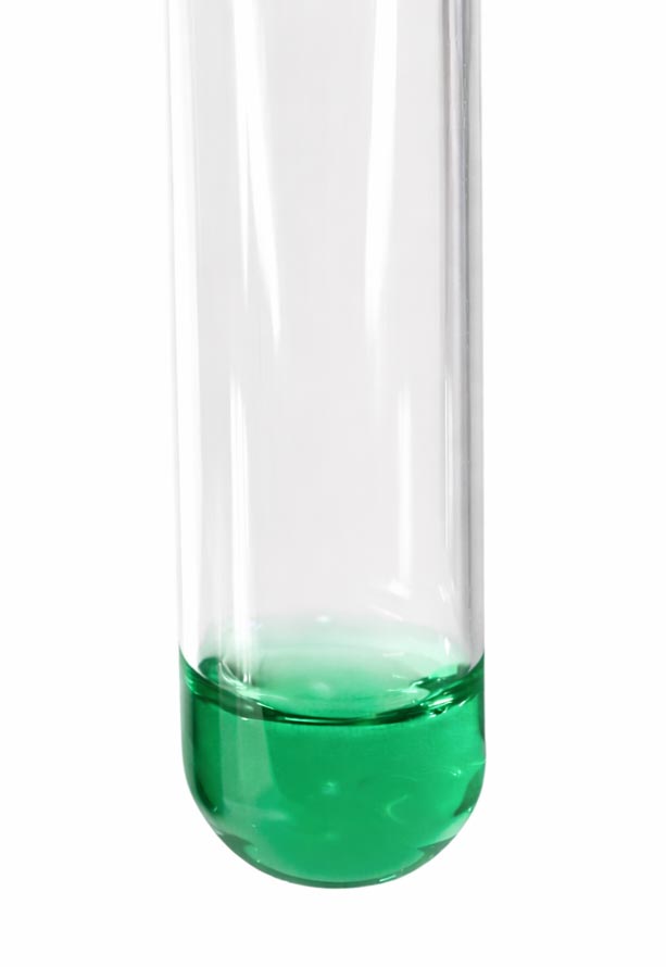 Test tube partially filled with Inula Essential Oil showing the oil's emerald green color
